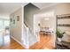 Elegant foyer featuring hardwood floors, a staircase, and an archway leading to the dining room at 1812 Riverton Dr, Suwanee, GA 30024