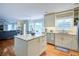 Modern kitchen features an island, granite countertops, and stainless steel appliances at 1812 Riverton Dr, Suwanee, GA 30024