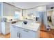 Updated kitchen with granite countertops, stainless steel appliances and island at 1812 Riverton Dr, Suwanee, GA 30024