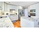 Well-appointed kitchen features stainless steel appliances, granite counters, and a central island at 1812 Riverton Dr, Suwanee, GA 30024