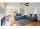 Cozy living room with hardwood floors, fireplace, and comfortable seating area at 1812 Riverton Dr, Suwanee, GA 30024