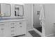 Modern bathroom features a double vanity, stylish mirrors, and walk-in shower at 2284 Dauphine St, East Point, GA 30344