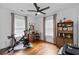 Bright room with a Peloton bike, a desk, and nice flooring at 2284 Dauphine St, East Point, GA 30344
