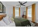 Inviting bedroom featuring bright curtains, hardwood floors, and geometric rug at 2284 Dauphine St, East Point, GA 30344