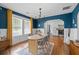 Bright dining room with hardwood floors, modern lighting, and views to kitchen at 2284 Dauphine St, East Point, GA 30344