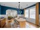 Charming dining room with hardwood floors, modern lighting, and views to living room at 2284 Dauphine St, East Point, GA 30344