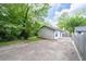 View of exterior features, driveway, privacy fence and siding of the home at 2284 Dauphine St, East Point, GA 30344