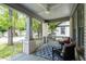 Relaxing front porch featuring comfortable seating and charming architectural details at 2284 Dauphine St, East Point, GA 30344