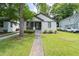 Charming brick home with a well-manicured lawn and inviting front porch at 2284 Dauphine St, East Point, GA 30344