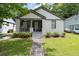 Charming brick home with a well-manicured lawn and inviting front porch at 2284 Dauphine St, East Point, GA 30344