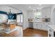 Spacious kitchen featuring hardwood floors, stainless steel appliances, and white cabinetry at 2284 Dauphine St, East Point, GA 30344