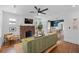 Stylish living room with a brick fireplace and open access to dining area at 2284 Dauphine St, East Point, GA 30344