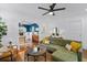Stylish living room with hardwood floors, a modern ceiling fan, and an open floor plan at 2284 Dauphine St, East Point, GA 30344
