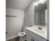 Modern bathroom features quartz countertop vanity, brushed nickel faucet, and shower with shelves at 5321 Tuscany Dr, Douglasville, GA 30135