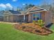 Beautiful single story brick home boasts a well manicured lawn and stylish gray shutters at 5321 Tuscany Dr, Douglasville, GA 30135