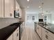 Modern kitchen featuring white cabinets, black countertops, and stainless steel appliances at 5321 Tuscany Dr, Douglasville, GA 30135
