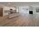 Spacious living room with hardwood floors, fireplace, and an island bar in the kitchen at 5321 Tuscany Dr, Douglasville, GA 30135