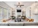 Cozy living room with fireplace, built-in shelving, ceiling fan, and lots of light at 75 High Top Ln, Atlanta, GA 30328