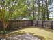 Fenced backyard with level lot and shed, offering privacy and potential for a garden or other outdoor activities at 1117 Balvaird Dr, Lawrenceville, GA 30045
