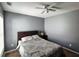 Bedroom featuring neutral gray walls, a window, and a nightstand at 1117 Balvaird Dr, Lawrenceville, GA 30045