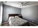 Bedroom featuring neutral gray walls, a window, and a nightstand at 1117 Balvaird Dr, Lawrenceville, GA 30045