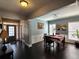 The dining room features dark hardwood floors and neutral paint tones and has seating for four at 1117 Balvaird Dr, Lawrenceville, GA 30045