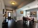 The dining room features dark hardwood floors and neutral paint tones and has seating for four at 1117 Balvaird Dr, Lawrenceville, GA 30045