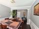 The dining room features dark hardwood floors and neutral paint tones and has seating for four at 1117 Balvaird Dr, Lawrenceville, GA 30045