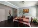 The dining room features dark hardwood floors and neutral paint tones and has seating for four at 1117 Balvaird Dr, Lawrenceville, GA 30045
