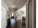 Bright foyer with hardwood floors, a view of the front door, and an adjacent dining area with wainscoting at 1117 Balvaird Dr, Lawrenceville, GA 30045