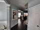 Hallway with hardwood floors and decorative features, leading to other rooms at 1117 Balvaird Dr, Lawrenceville, GA 30045