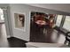 View of an eat-in kitchen with dark wood floors and cabinets seen from an open staircase landing at 1117 Balvaird Dr, Lawrenceville, GA 30045