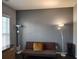 Living room with hardwood floors, neutral paint, large window and contemporary lighting at 1117 Balvaird Dr, Lawrenceville, GA 30045