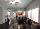 Cozy living room featuring hardwood floors, a ceiling fan, and large windows for natural light at 1117 Balvaird Dr, Lawrenceville, GA 30045