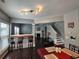 Open-concept living room featuring a breakfast bar, fireplace, and access to an outdoor space at 1117 Balvaird Dr, Lawrenceville, GA 30045