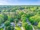 Overhead view showcasing the home's setting amidst a canopy of lush, mature trees at 118 Greenwood St, Fairburn, GA 30213
