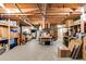 Unfinished basement offering ample storage space with exposed wood beams and shelving at 375 Spindle Ct, Sandy Springs, GA 30350