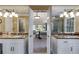 Main bathroom with marble countertops and double sinks leads to a spacious main bedroom suite at 375 Spindle Ct, Sandy Springs, GA 30350
