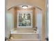 Relaxing bathtub nook with window and natural light makes this bathroom feel like a spa at 375 Spindle Ct, Sandy Springs, GA 30350