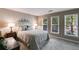 Neutral bedroom features large windows, soft carpet, and ample space at 375 Spindle Ct, Sandy Springs, GA 30350