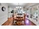 Bright dining room with hardwood floors, chandelier, and views into the kitchen at 375 Spindle Ct, Sandy Springs, GA 30350