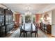 Formal dining room with a large wooden table, china cabinet, and elegant chandelier at 375 Spindle Ct, Sandy Springs, GA 30350