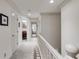 Upstairs hallway features white trim, carpet, and access to all bedrooms at 375 Spindle Ct, Sandy Springs, GA 30350