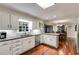 Spacious kitchen featuring white cabinets, granite countertops, and stainless steel appliances at 375 Spindle Ct, Sandy Springs, GA 30350