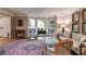 Cozy living room featuring bay windows, hardwood floors, a patterned rug, and elegant decor at 375 Spindle Ct, Sandy Springs, GA 30350