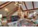Open living area with vaulted ceilings, hardwood floors, and an elegant staircase at 375 Spindle Ct, Sandy Springs, GA 30350