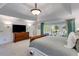 Generous main bedroom featuring a tray ceiling and a sitting area with a bay window at 375 Spindle Ct, Sandy Springs, GA 30350