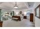 Spacious main bedroom features tray ceilings, bay window with seating, and a decorative chandelier at 375 Spindle Ct, Sandy Springs, GA 30350