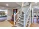 Elegant staircase with white railing and hardwood floors leading to the upper level at 375 Spindle Ct, Sandy Springs, GA 30350
