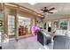 Relaxing sunroom with brick accents, tile floors, and views of the outdoor landscape at 375 Spindle Ct, Sandy Springs, GA 30350